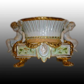 Fine porcelain putti planter marked with two swords R.B.
