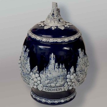 Antique German ceramic punch pot, cobalt blue, with a relief castle design