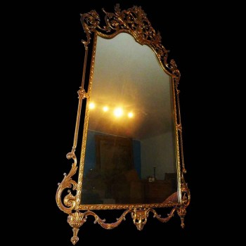 Espejo estilo Luis XVI en bronce dorado del siglo XIX.