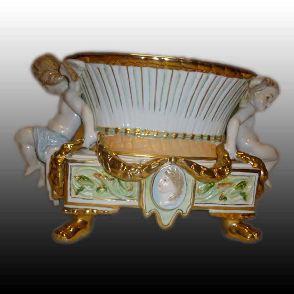 Putti planter in fine porcelain marked with two R.B.